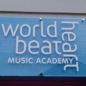 White vinyl logo for music academy on clear acrylic